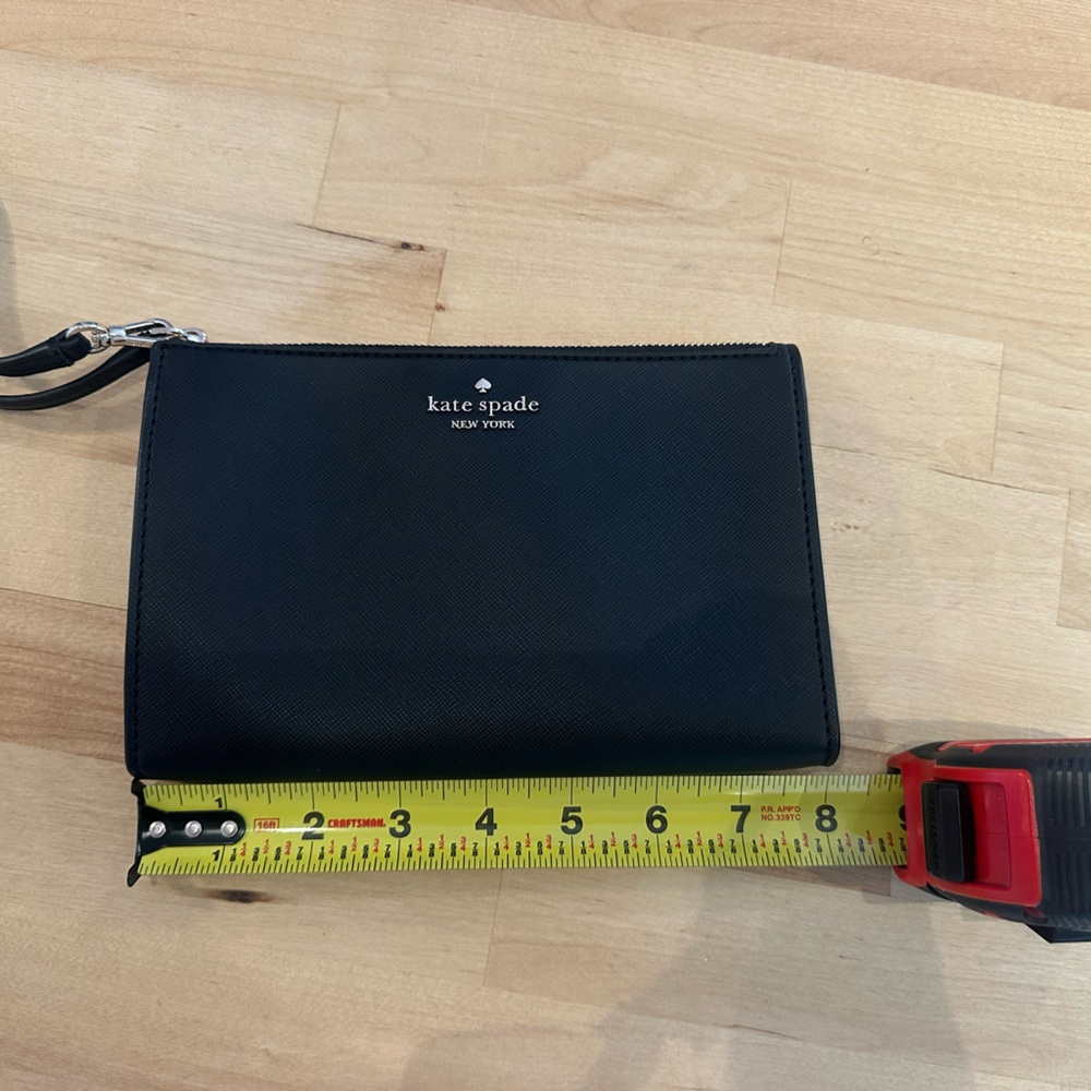 Black Kate spade wristlet. Never been used.